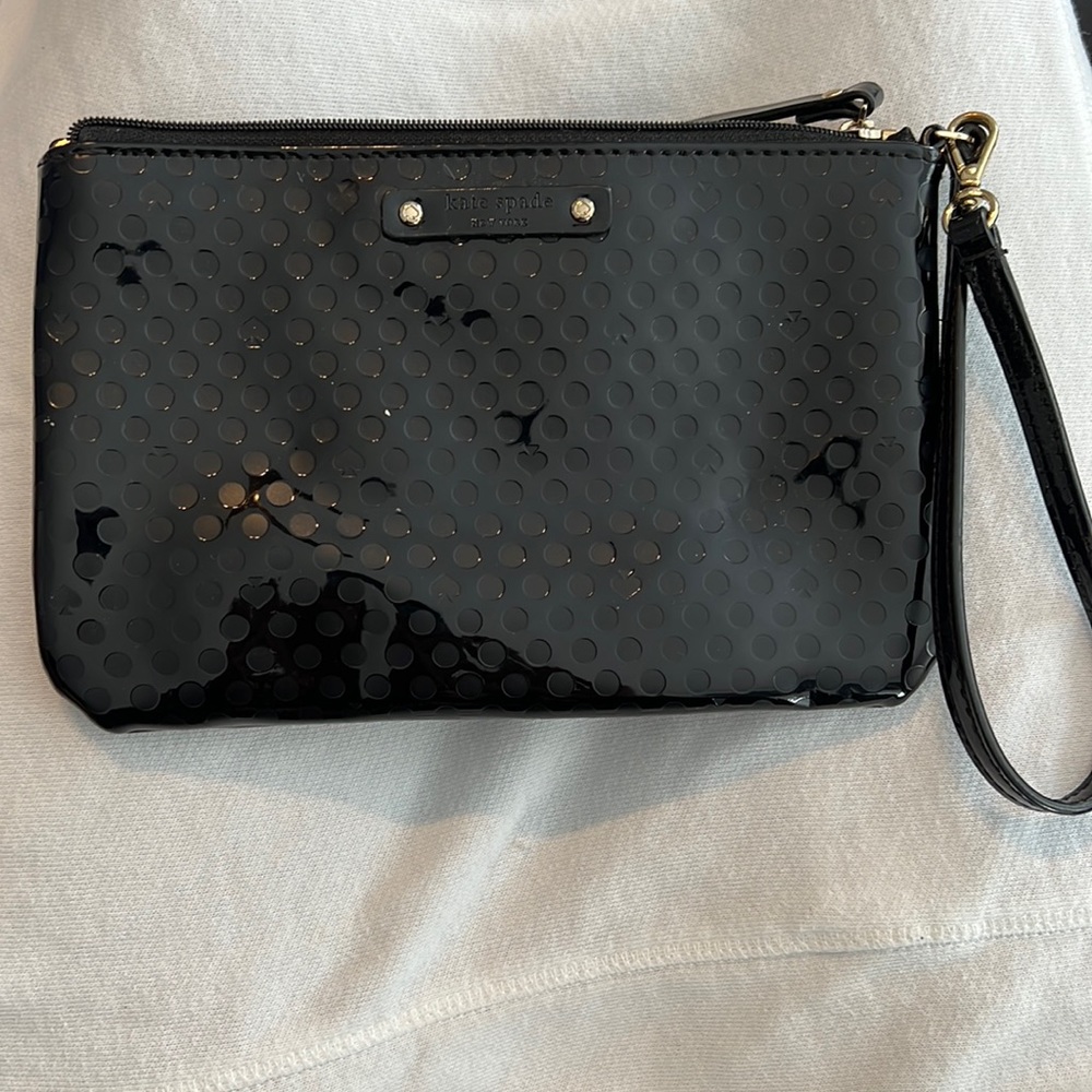 Kate Spade Glossy Black Wristlet polka dot pattern and pink silk interior
